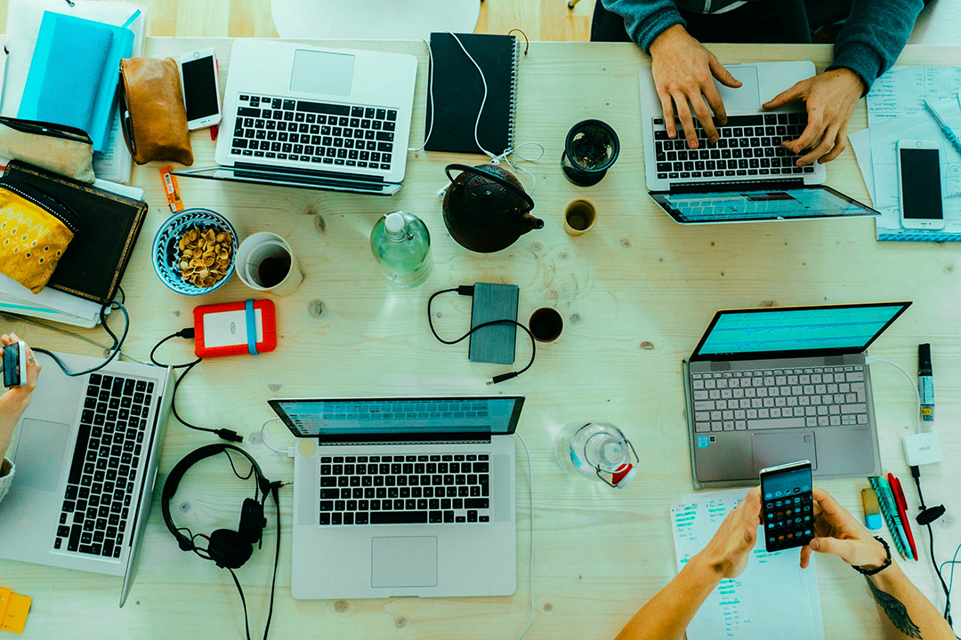 opened laptops on table for social media monitoring