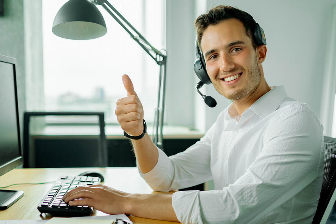 Call center agent raising thumb up