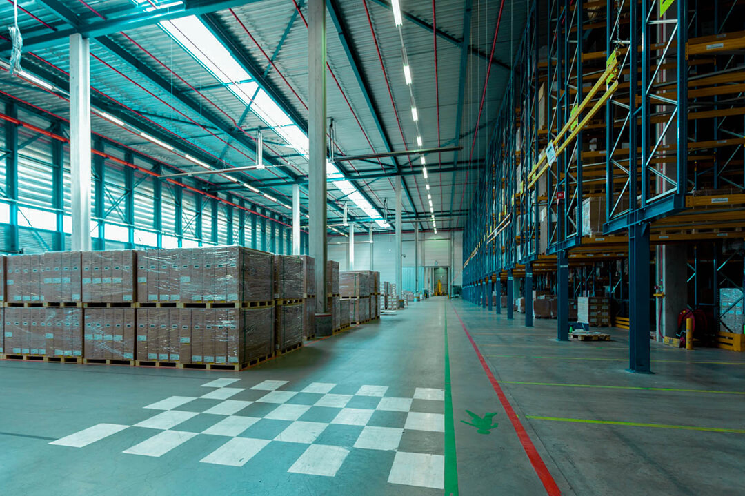 interior of a large warehouse needing an order management system